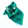 Green patterned fabric on a white background